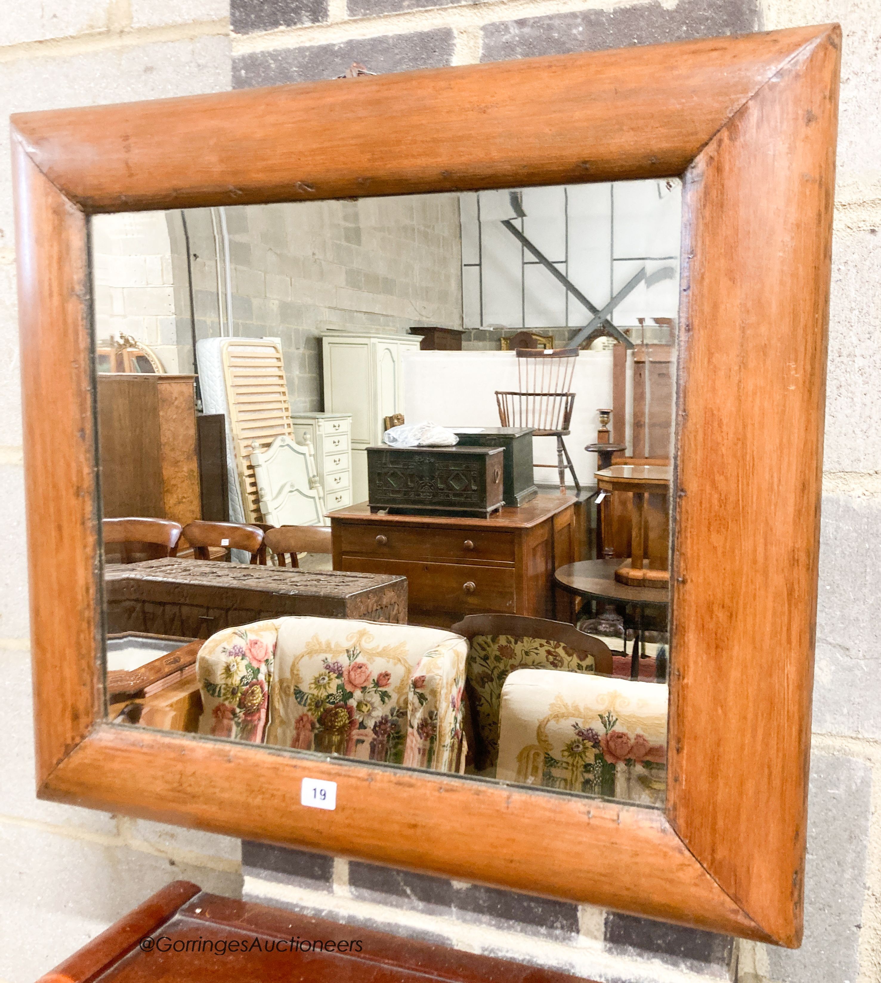 A late Victorian antique style pine cushion mirror, width 70cm, height 66cm